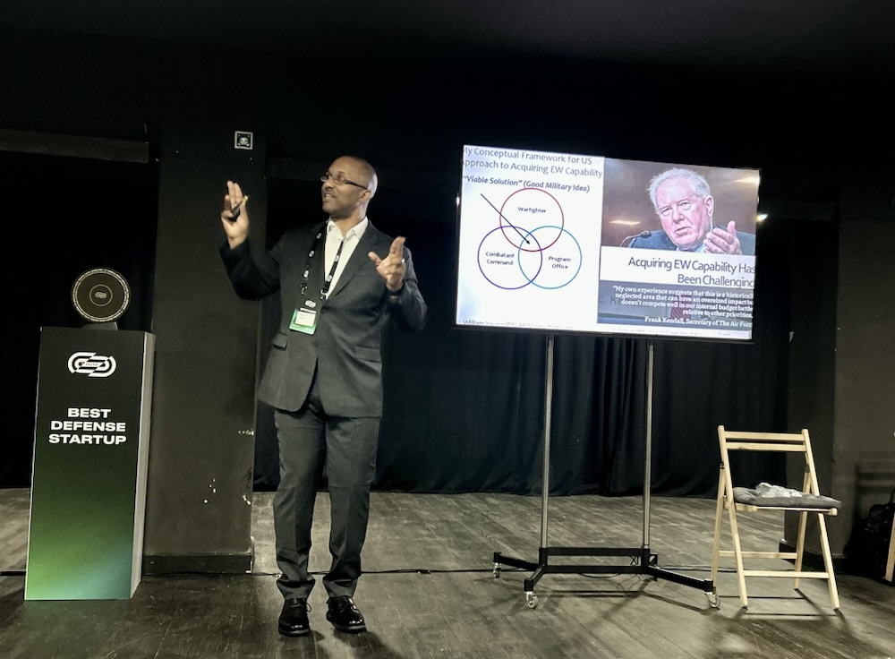 Presentation on stage at a defense event
